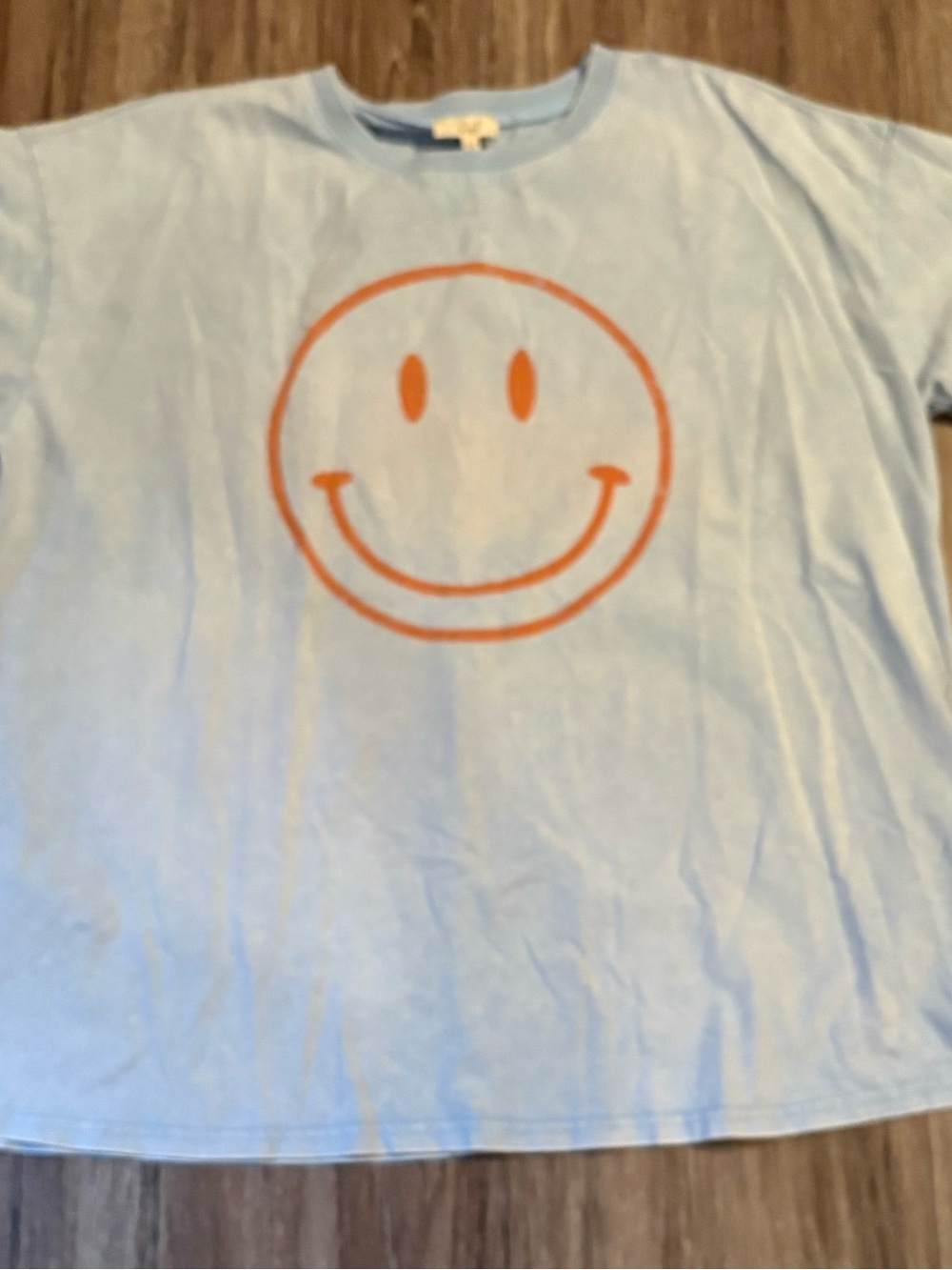 EASEL Light Blue Tee with Orange Smiley Face